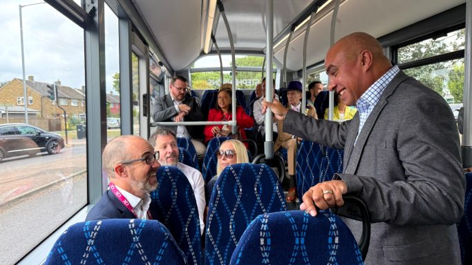 On the new Leigh Link! David smiling and chatting with passengers on a bus