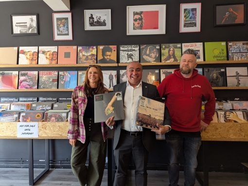 Celebrating Record Store Day 2025! David with staff at Save Our Souls Records in Leigh, smiling with two vinyls.