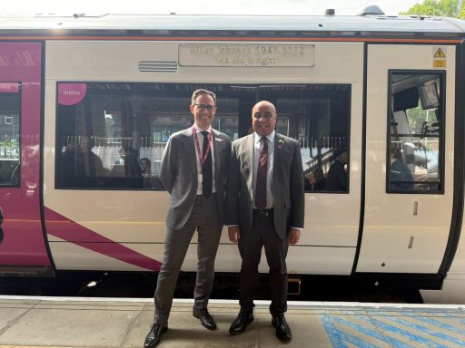 The newly named Wilko Johnson train! (June 2025) David and a representative of c2c standing in front of a train carriage named after Wilko Johnson