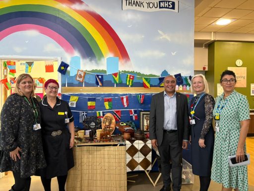 Southend Hospital Meeting David smiling with staff at Southend Hospital