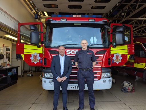 Visiting Leigh Fire Station! David and a firefighter stand in front of a fire engine
