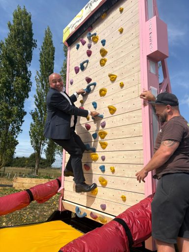 Climbing with IndiRock! David part-way up a climbing wall