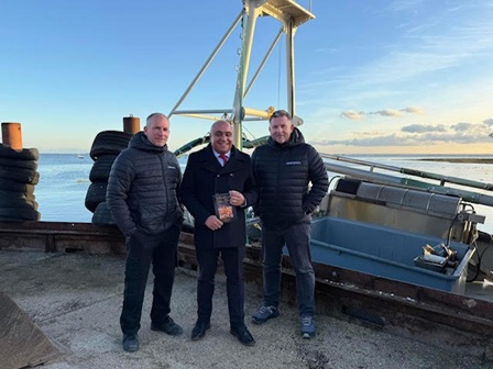 Meeting with Osborne's David with Andrew Lawrence and Graham Osborne by a fishing boat